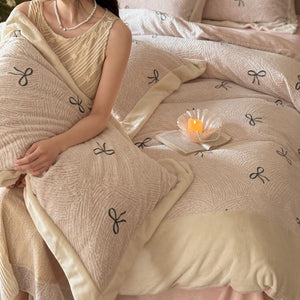 VILZSTUDIOS blush pink fleece bedding set with black embroidered bows and plush cream borders