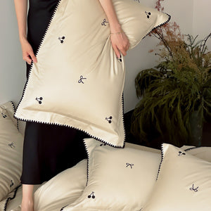 VILZSTUDIOS pastel satin duvet cover set with black cherry and bow embroidery and black zigzag borders