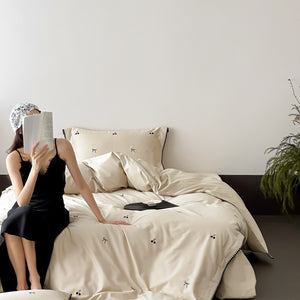 VILZSTUDIOS pastel satin duvet cover set with black cherry and bow embroidery and black zigzag borders