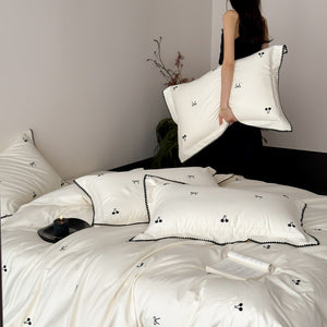 VILZSTUDIOS pastel satin duvet cover set with black cherry and bow embroidery and black zigzag borders