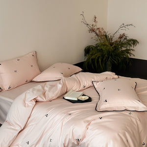 VILZSTUDIOS pastel satin duvet cover set with black cherry and bow embroidery and black zigzag borders