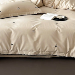 VILZSTUDIOS pastel satin duvet cover set with black cherry and bow embroidery and black zigzag borders