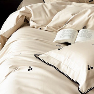 VILZSTUDIOS pastel satin duvet cover set with black cherry and bow embroidery and black zigzag borders