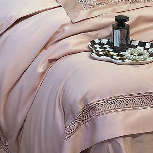 VILZSTUDIOS blush pink satin bedding set with geometric cut-out lace borders