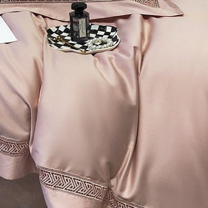 VILZSTUDIOS blush pink satin bedding set with geometric cut-out lace borders