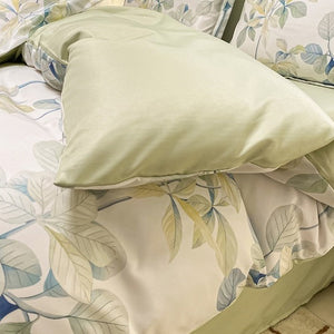 VILZSTUDIOS soft green and blue botanical print satin bedding set with coordinating solid-color reverse