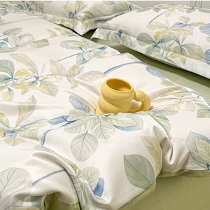 VILZSTUDIOS soft green and blue botanical print satin bedding set with coordinating solid-color reverse