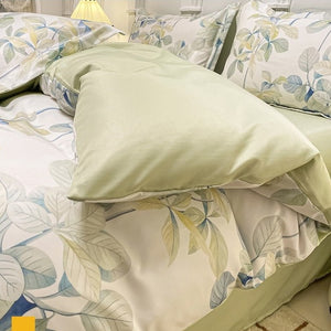 VILZSTUDIOS soft green and blue botanical print satin bedding set with coordinating solid-color reverse