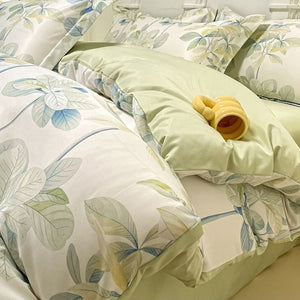 VILZSTUDIOS soft green and blue botanical print satin bedding set with coordinating solid-color reverse