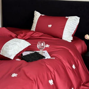VILZSTUDIOS deep red or blush pink satin duvet cover set with embroidered bows and ivory ruffled pillowcases
