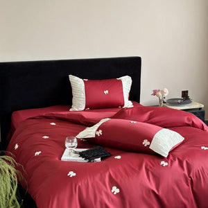 VILZSTUDIOS deep red or blush pink satin duvet cover set with embroidered bows and ivory ruffled pillowcases