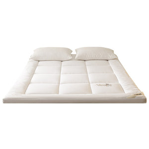 VILZSTUDIOS solid-color box-quilted mattress pad with tonal botanical embroidery and a thick cushioned border