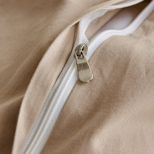 VILZSTUDIOS neutral and pastel two-tone duvet cover set with round button details on pillowcases
