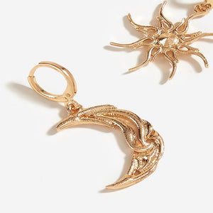 VILZSTUDIOS Mismatched earrings featuring a crescent moon and sun design