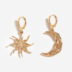 VILZSTUDIOS Mismatched earrings featuring a crescent moon and sun design