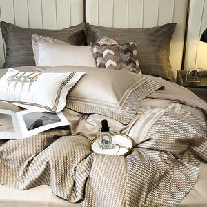 VILZSTUDIOS champagne and taupe satin bedding set with houndstooth borders and geometric ribbon trim