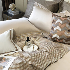 VILZSTUDIOS champagne and taupe satin bedding set with houndstooth borders and geometric ribbon trim