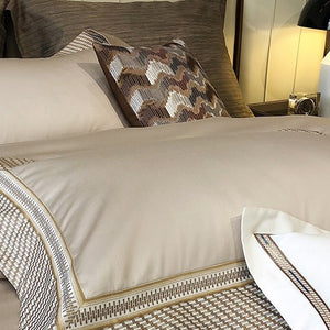 VILZSTUDIOS champagne and taupe satin bedding set with houndstooth borders and geometric ribbon trim