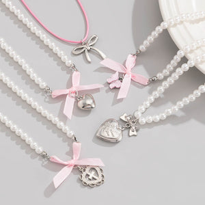 VILZSTUDIOS Layered pearl necklace set with charms and bows
