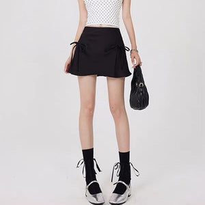 VILZSTUDIOS Chic satin mini skirt with bows by VILZSTUDIOS
