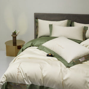 VILZSTUDIOS two-tone satin bedding set with broad contrasting borders and script embroidery