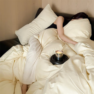 VILZSTUDIOS Neutral and pastel solid-color bedding set with contrast piping on the duvet cover and matching pillowcases