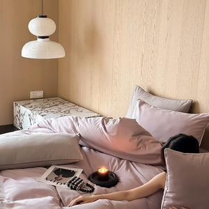 VILZSTUDIOS Neutral and pastel solid-color bedding set with contrast piping on the duvet cover and matching pillowcases