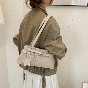 VILZSTUDIOS faux suede shoulder bag with heart charm