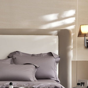 VILZSTUDIOS solid-color satin duvet cover set with matching wide flanged pillowcases and a flat sheet