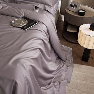 VILZSTUDIOS solid-color satin duvet cover set with matching wide flanged pillowcases and a flat sheet