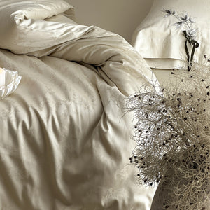 VILZSTUDIOS pale champagne botanical jacquard duvet cover set with embroidered branches and dark green pillowcase bows