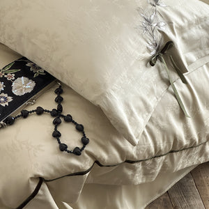 VILZSTUDIOS pale champagne botanical jacquard duvet cover set with embroidered branches and dark green pillowcase bows