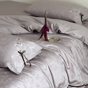 VILZSTUDIOS pale champagne botanical jacquard duvet cover set with embroidered branches and dark green pillowcase bows