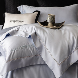 VILZSTUDIOS solid-color satin duvet cover set with wide flanged borders and delicate hemstitch trim