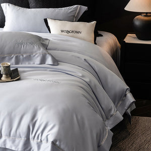 VILZSTUDIOS solid-color satin duvet cover set with wide flanged borders and delicate hemstitch trim