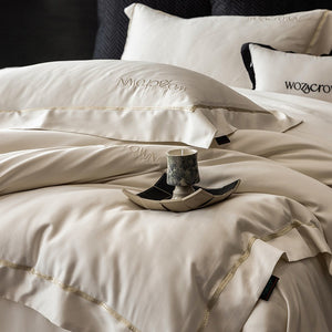 VILZSTUDIOS solid-color satin duvet cover set with wide flanged borders and delicate hemstitch trim