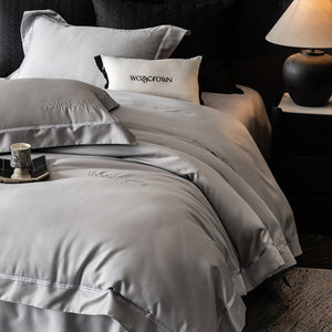 VILZSTUDIOS solid-color satin duvet cover set with wide flanged borders and delicate hemstitch trim