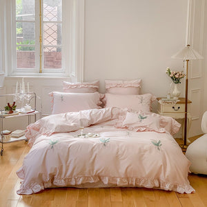 VILZSTUDIOS cream and sage green bedding set with lily-of-the-valley embroidery, lace detailing and layered ruffle trims