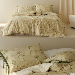 VILZSTUDIOS cream-yellow botanical duvet cover set with olive floral stems and ribbon-tie pillowcases