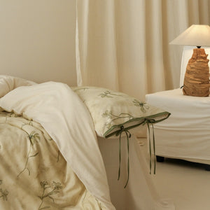 VILZSTUDIOS cream-yellow botanical duvet cover set with olive floral stems and ribbon-tie pillowcases