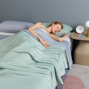 VILZSTUDIOS pastel two-tone summer quilt with circular quilting and piped edges
