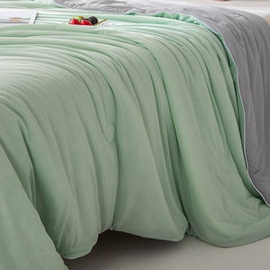 VILZSTUDIOS pastel two-tone summer quilt with circular quilting and piped edges