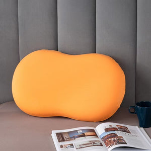 VILZSTUDIOS orange, sky blue, blush pink and charcoal gray peanut-shaped neck pillow with a central dip