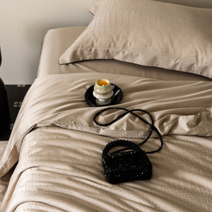 VILZSTUDIOS neutral satin jacquard duvet cover set with wide pillowcase borders and dark contrast piping