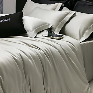 VILZSTUDIOS muted solid-color satin duvet cover set with piped borders and flanged pillowcases