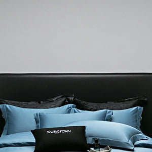 VILZSTUDIOS muted solid-color satin duvet cover set with piped borders and flanged pillowcases