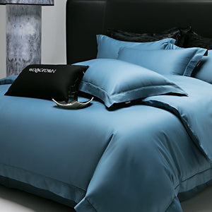 VILZSTUDIOS muted solid-color satin duvet cover set with piped borders and flanged pillowcases
