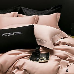 VILZSTUDIOS muted solid-color satin duvet cover set with piped borders and flanged pillowcases