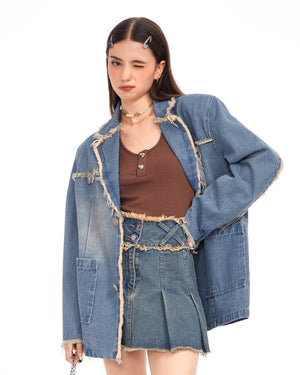 VILZSTUDIOS Ripped denim blazer with butterfly pin and frayed edges