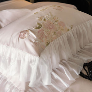 VILZSTUDIOS pale blush pink satin bedding set with rose embroidery and sheer ruffled edges